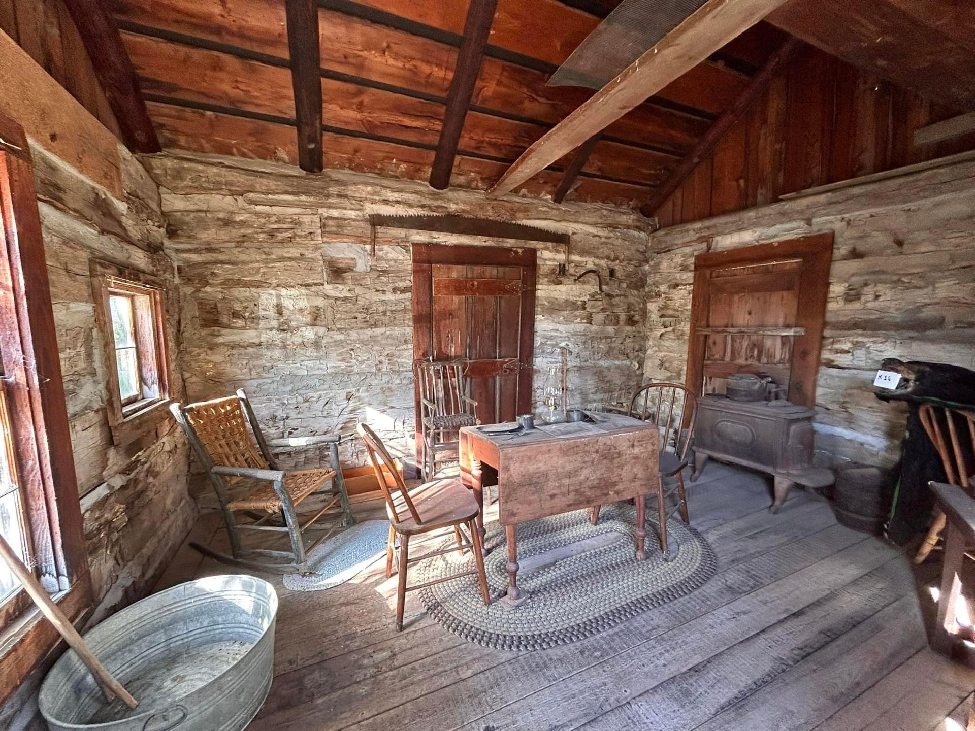  Interior of a preserved pioneer-era log cabin at Clarke County Historical Museum in Osceola, Iowa