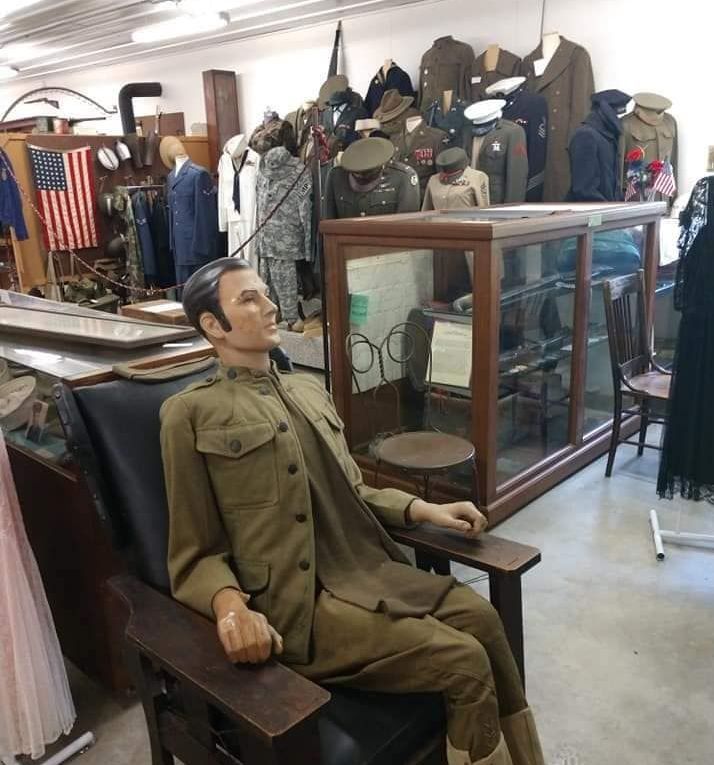 Exhibit room at Clarke County Historical Museum in Osceola, Iowa--military uniforms, artifacts, Clarke County's past.