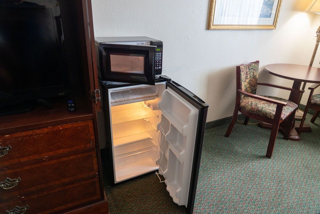 TV, fridge, microwave in hotel room