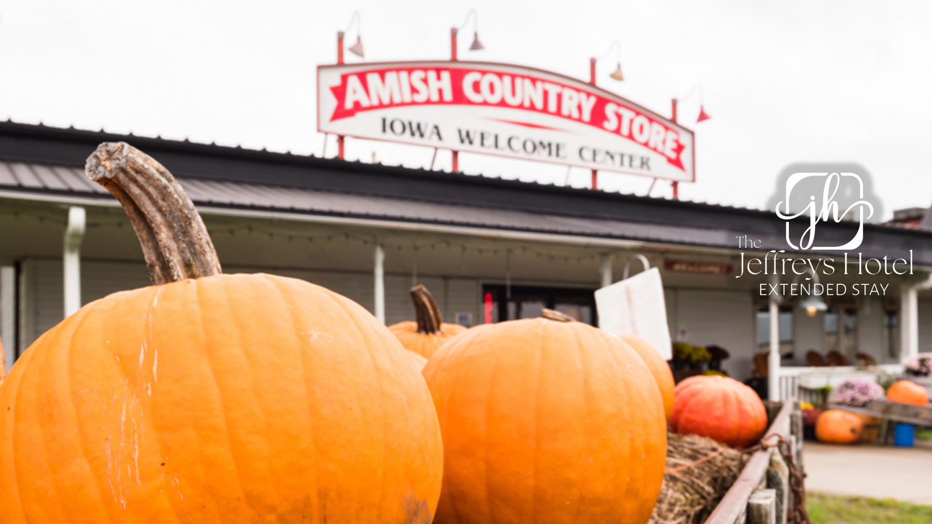 Pumpkins in front of Amish Country Store, Iowa Welcome Center, on an overcast day.