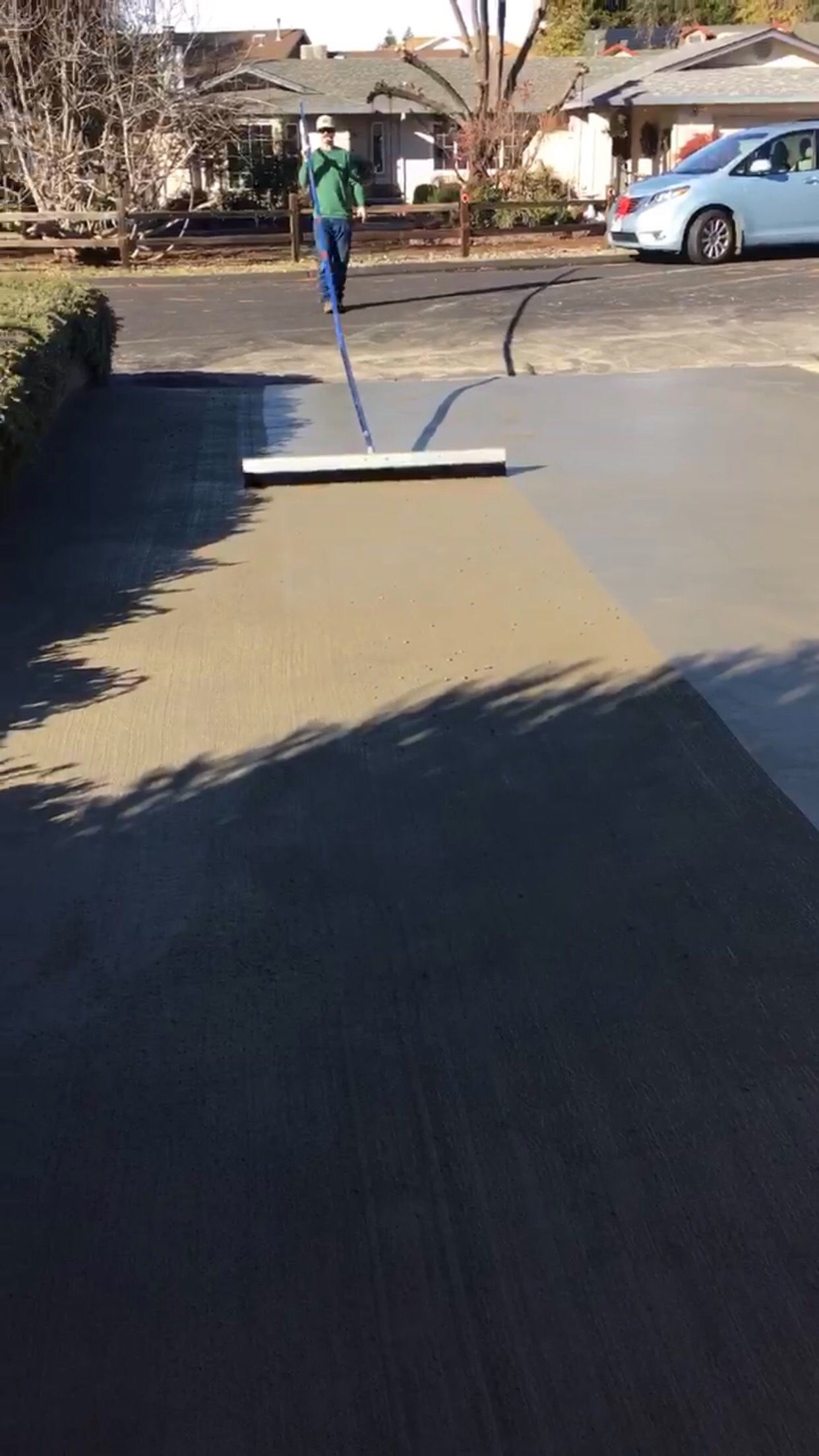 broom finishing driveway