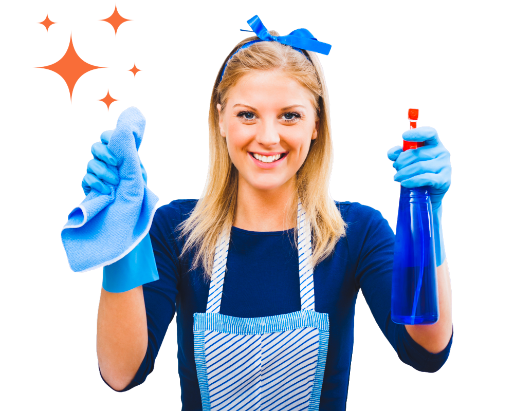 A woman in an apron is holding a spray bottle and a cloth.