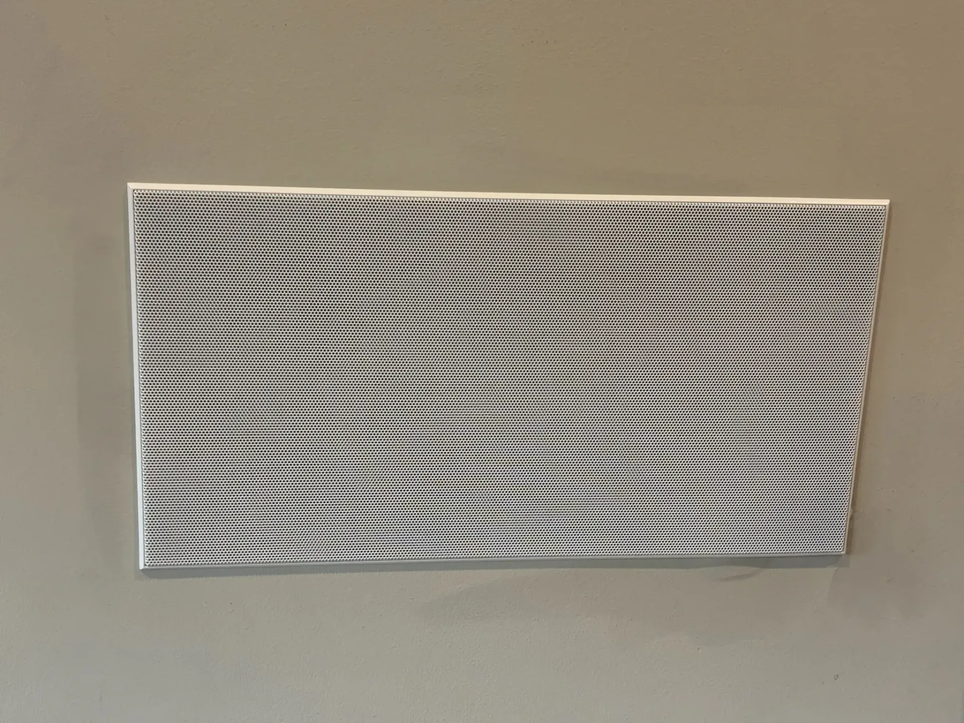 A rectangular piece of art featuring a pattern of horizontal, wavy black lines set against a white background.