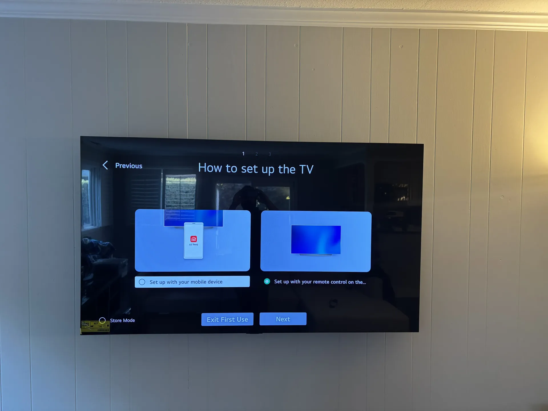 A wall-mounted television displaying a 