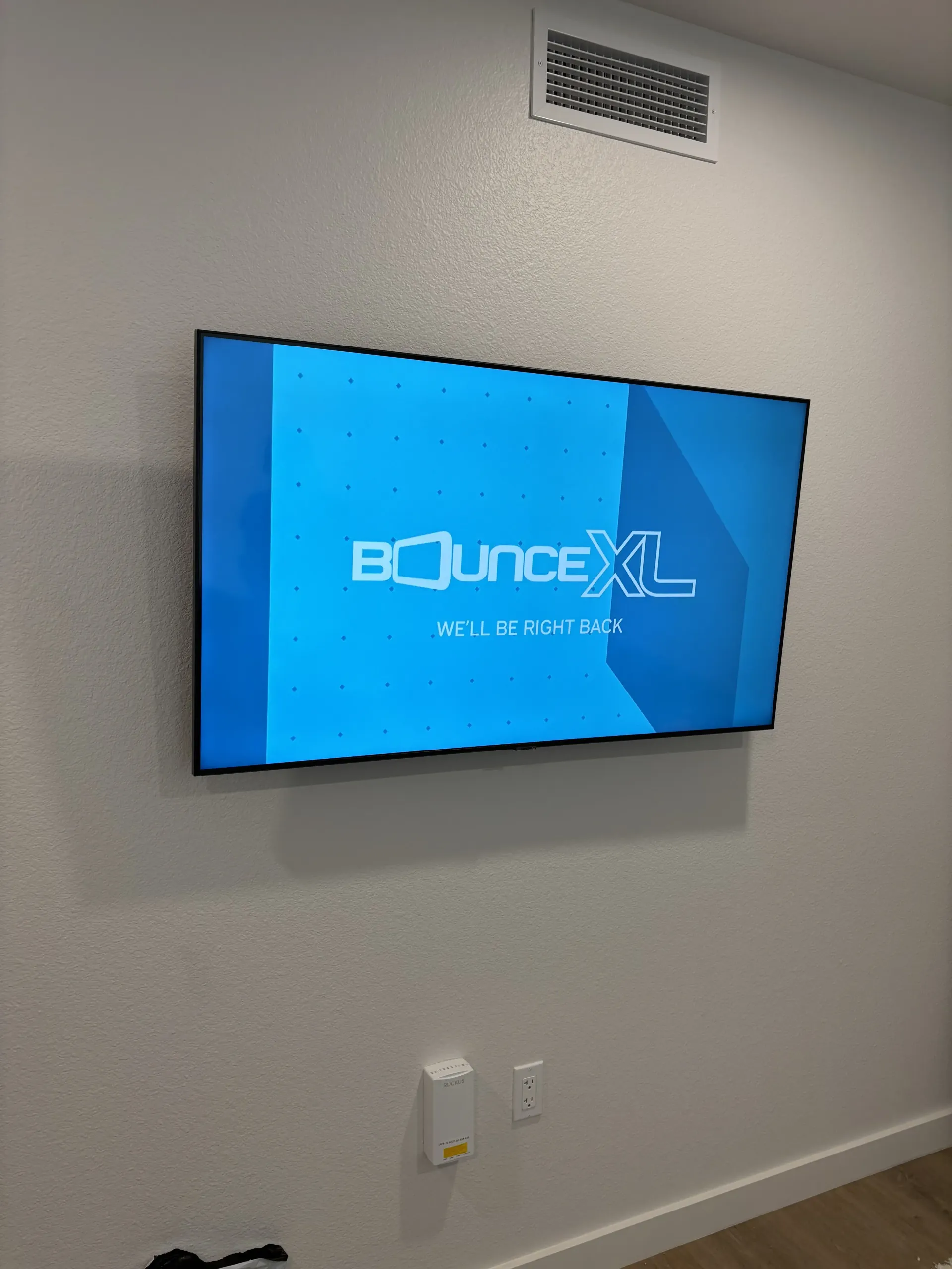 A wall-mounted television displaying the 