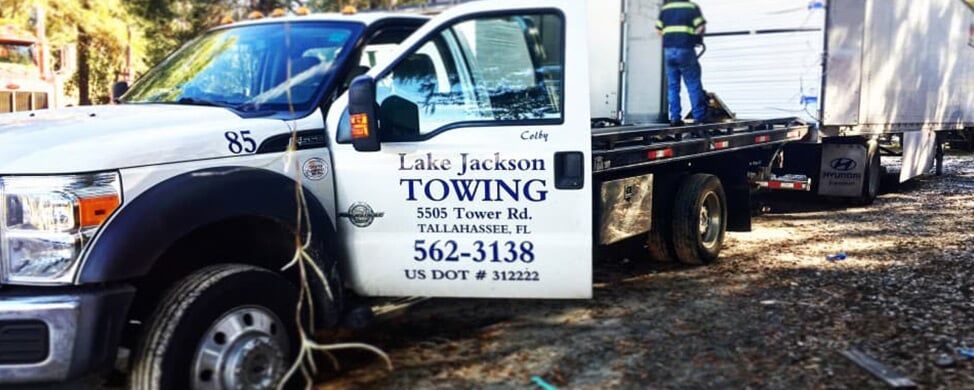 White Truck Open Door - towing in Tallahassee FL