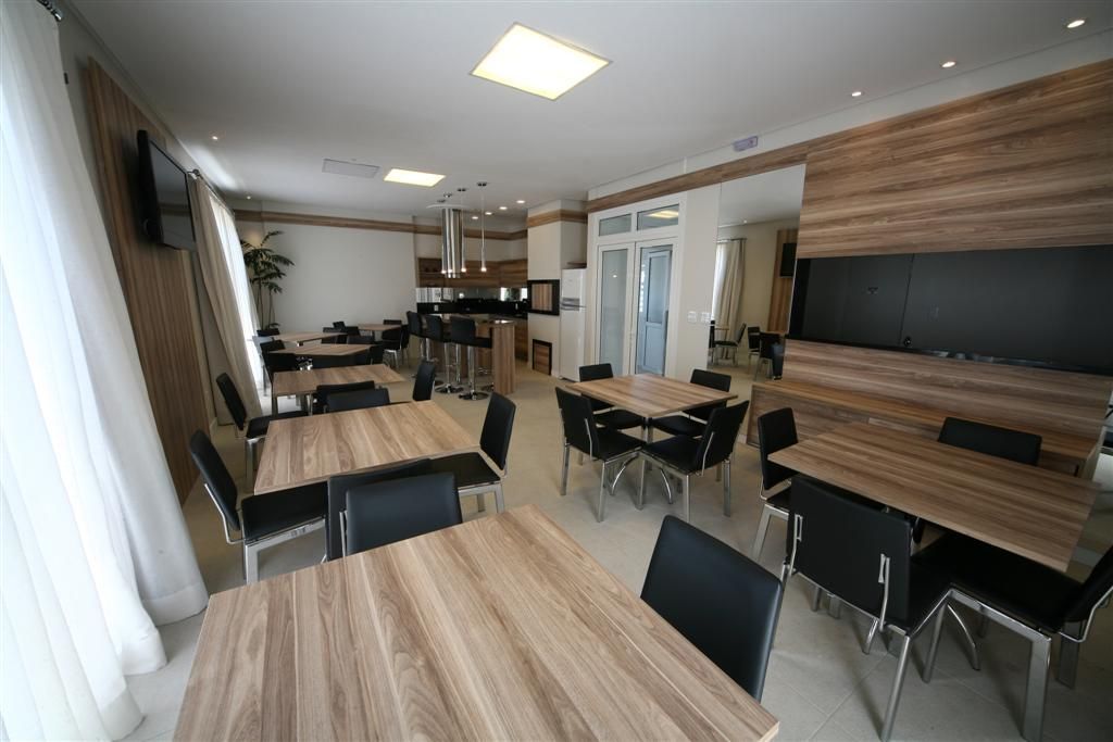 A large room with tables and chairs in it