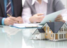 coverage holder and agent reviewing home insurance policy