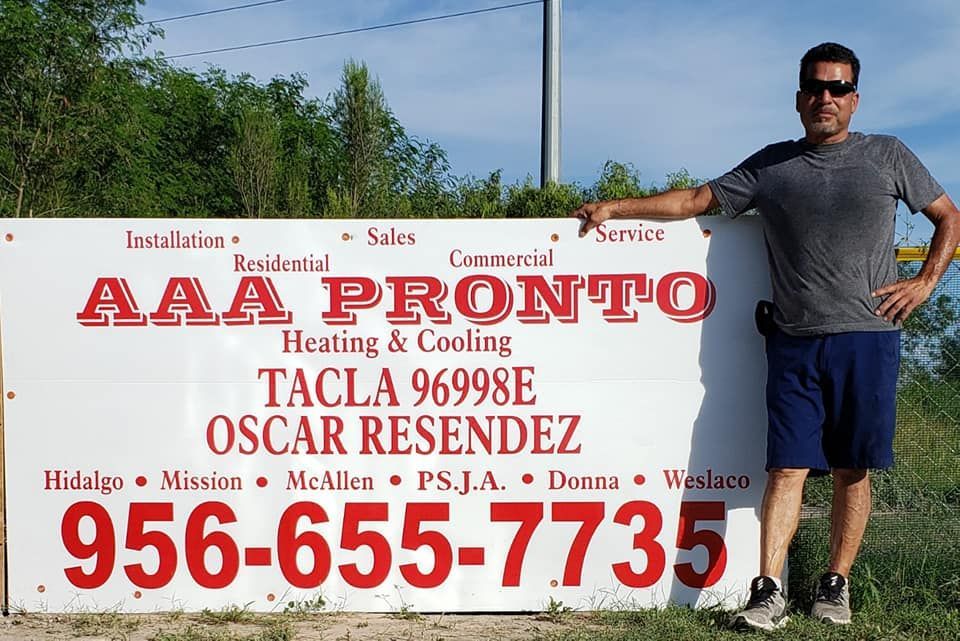 A man standing in front of a sign that says aaa pronto