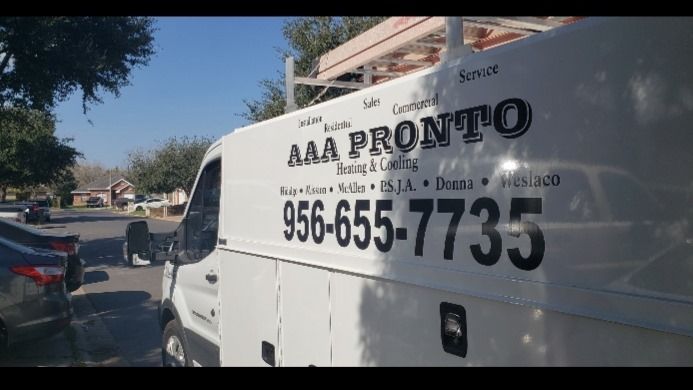 A white van with aaa pronto written on the side