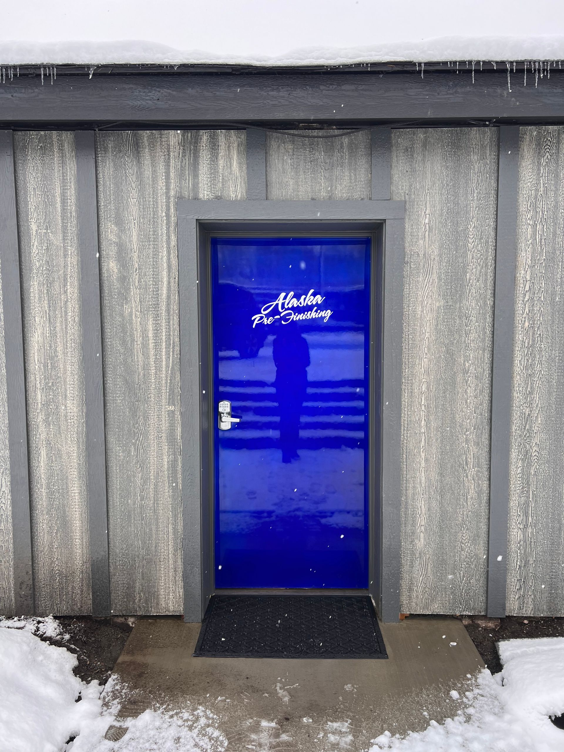 A blue door with the word nicole written on it