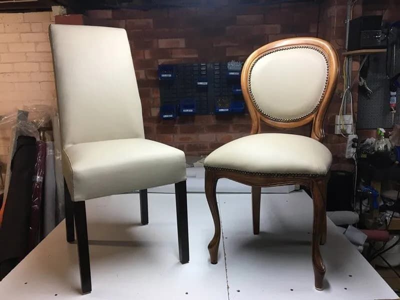 Two chairs are sitting next to each other on a white surface — Metreson Upholstery In Unanderra, NSW