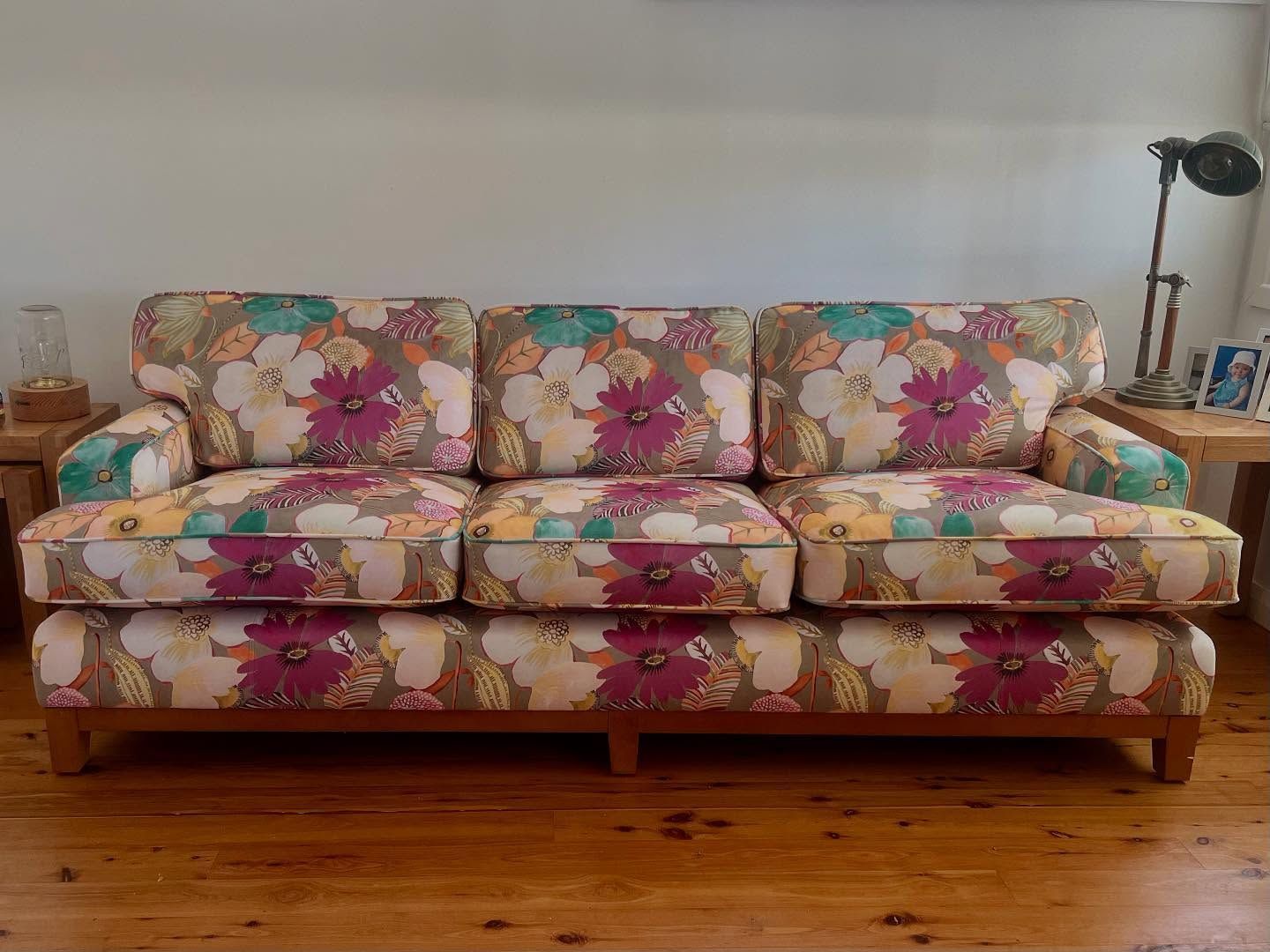 Floral-Patterned Sofa on A Wood Frame in A Room — Metreson Upholstery In Unanderra, NSW
