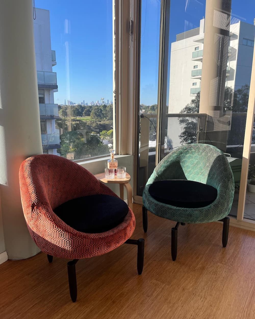 Two Chairs Are Sitting Next to Each Other in Front of A Window — Metreson Upholstery In Unanderra, NSW