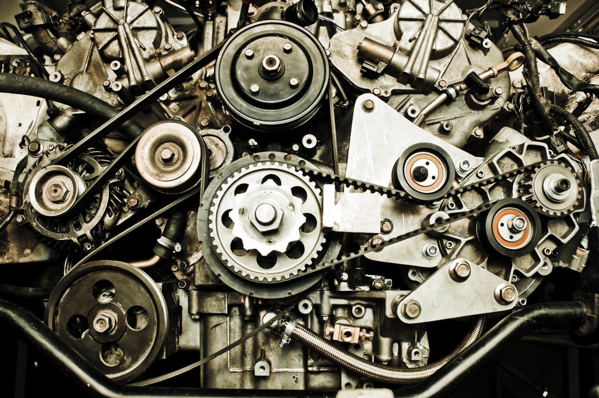 A close up of a machine with a lot of gears and pulleys.