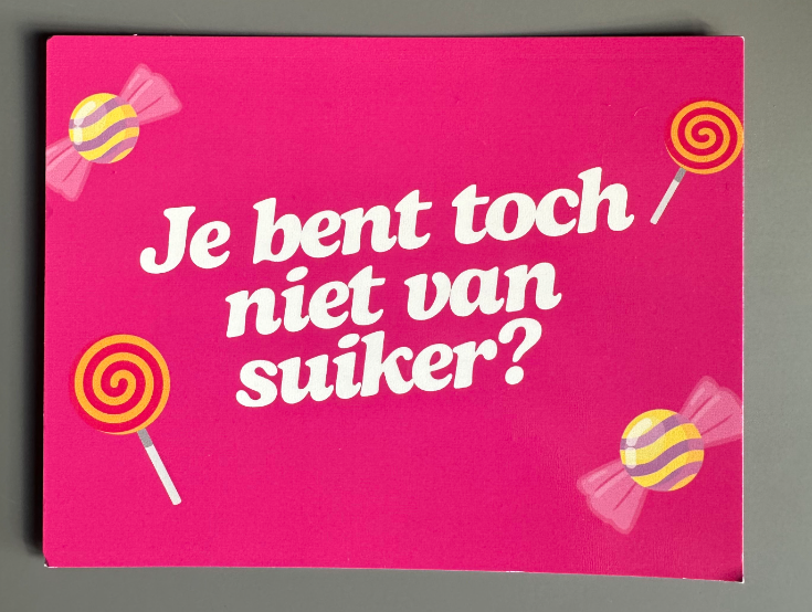 A pink card with illustrations of candies and the text