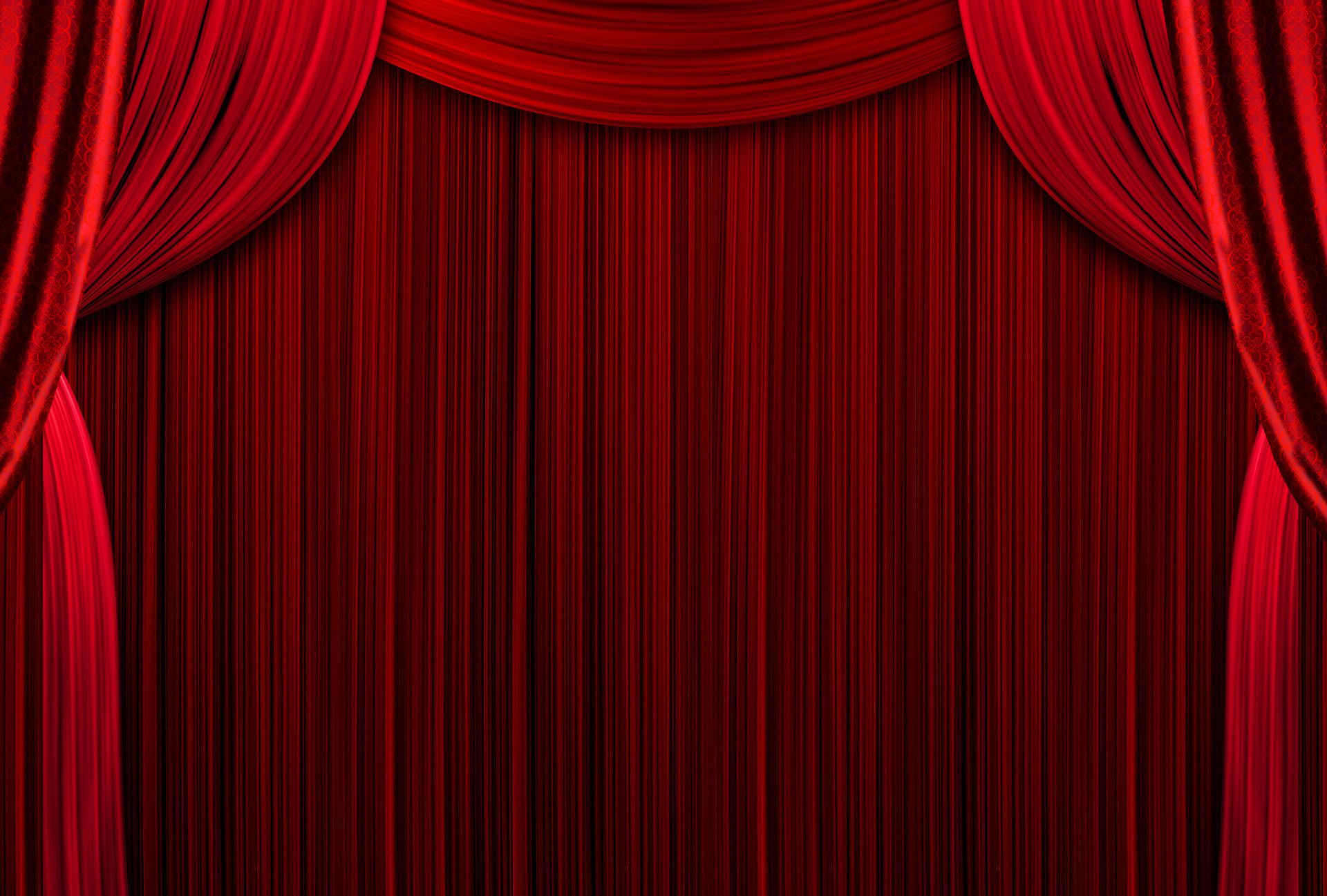 A close up of a red curtain on a stage.