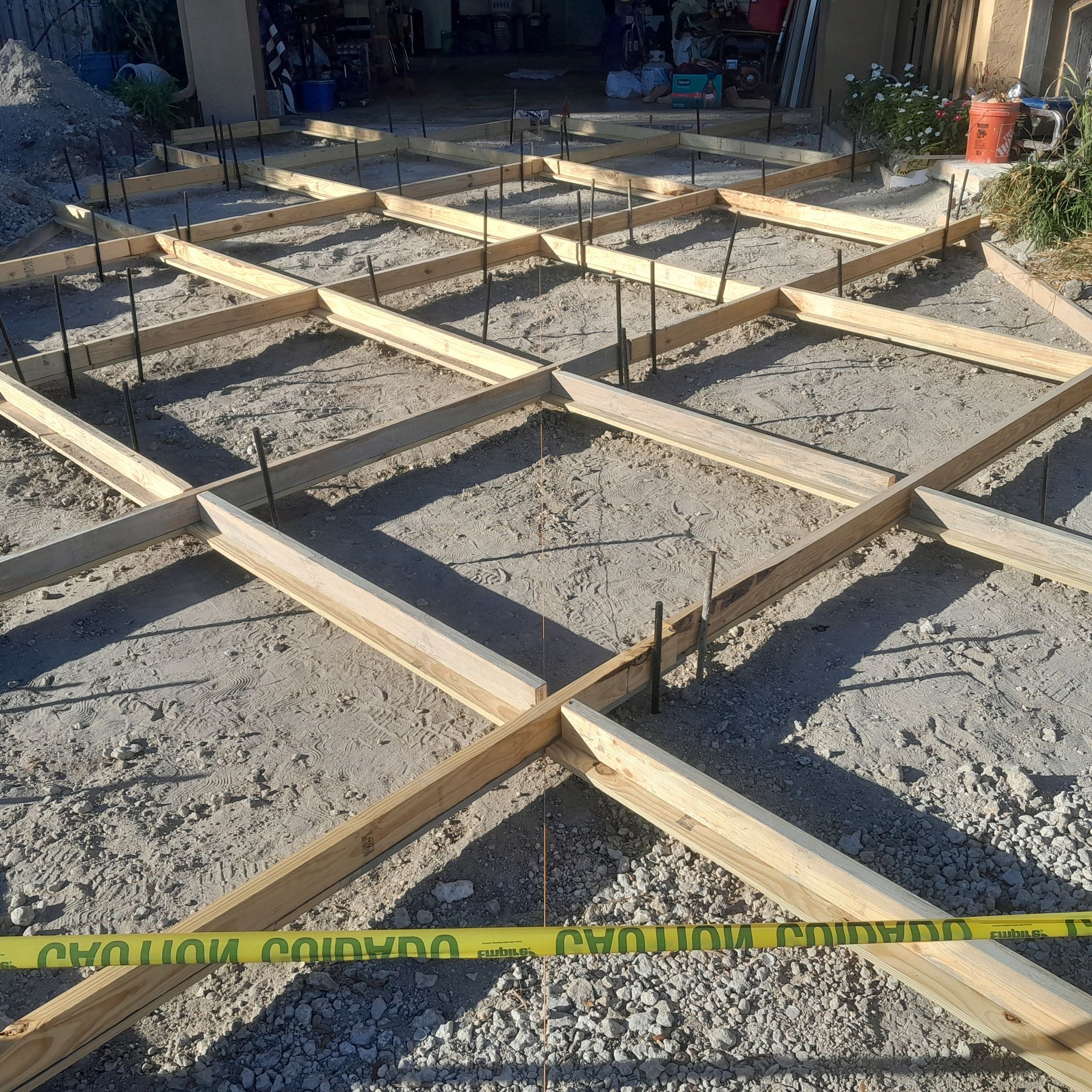 Wooden forms and rebar frame a concrete project outdoors in Parkland FL