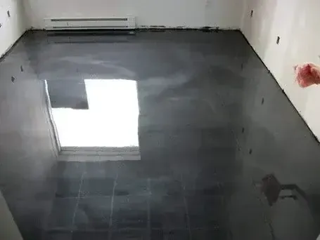 A close up of a tile floor with a blue border