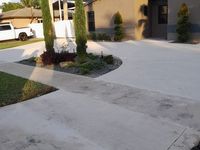 A white truck is parked in the driveway of a house