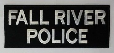 A black sign that says fall river police on it