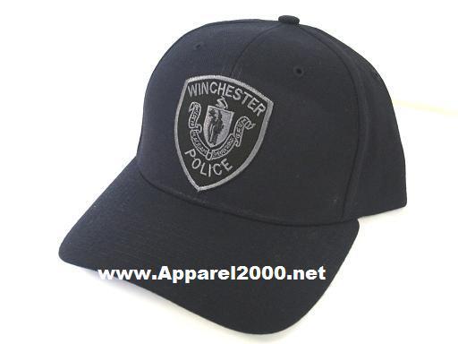 A black winchester police hat is sitting on a table