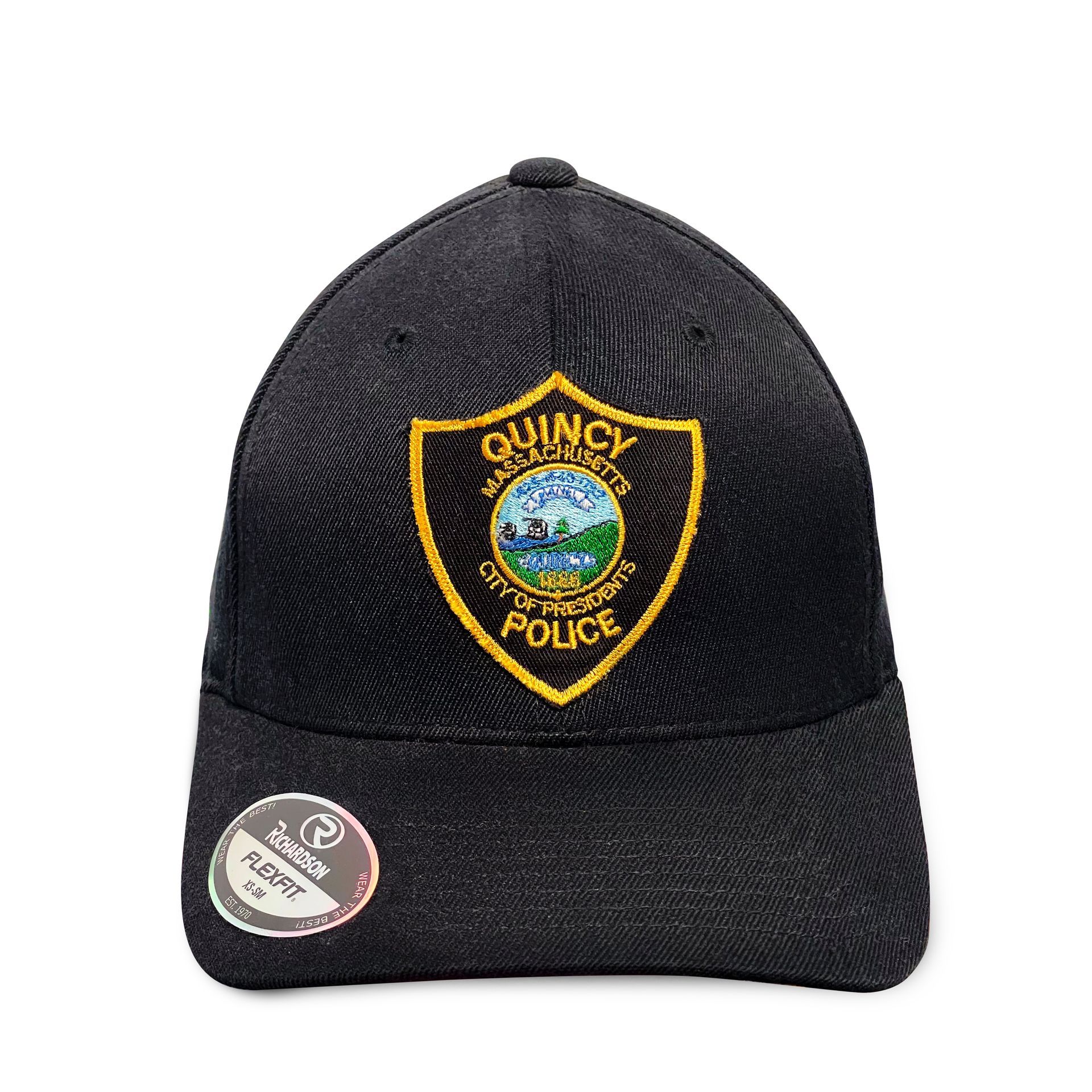 A black baseball cap with a quincy police badge on it.