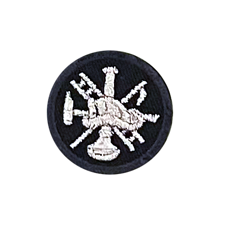 A black patch with a picture of a hand holding a trumpet in a circle.