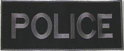 A black patch with the word police embroidered on it.