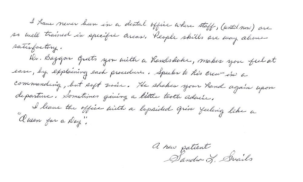 A letter is written in cursive on a white background