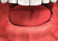 A close up of a person 's mouth with their tongue sticking out.