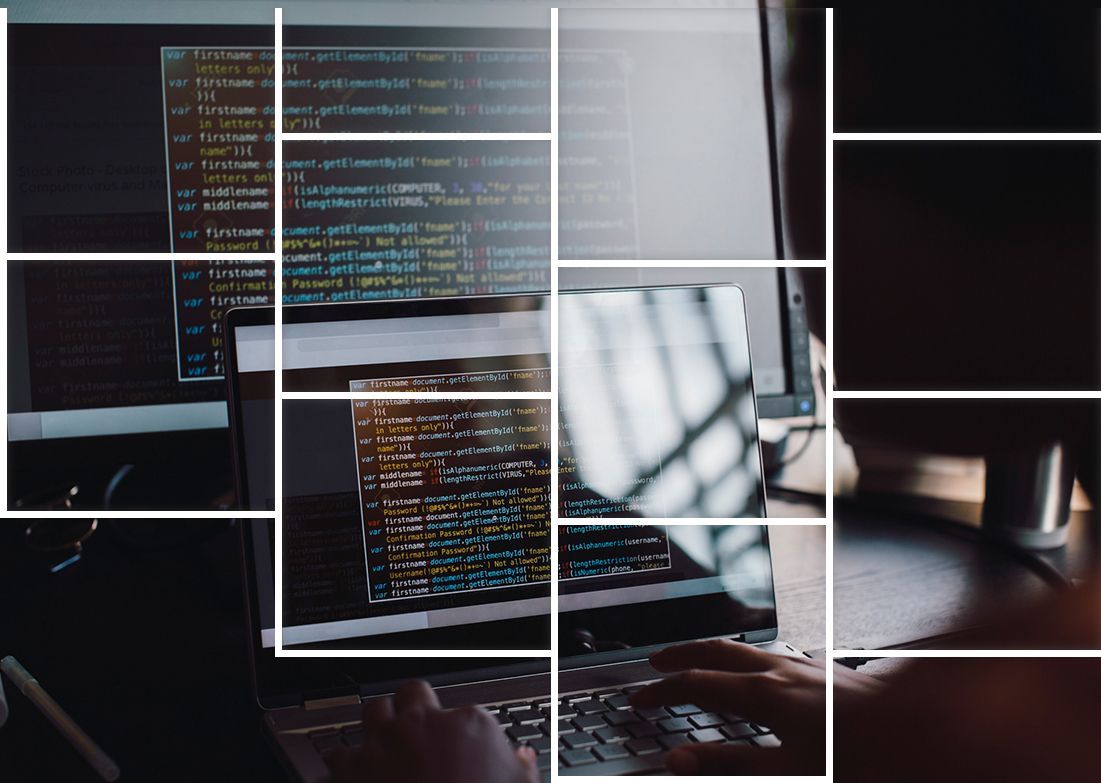 A person is typing on a laptop computer.