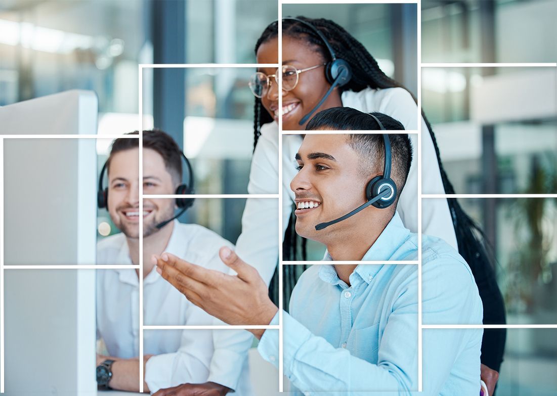 A group of people wearing headsets are sitting in front of a computer.