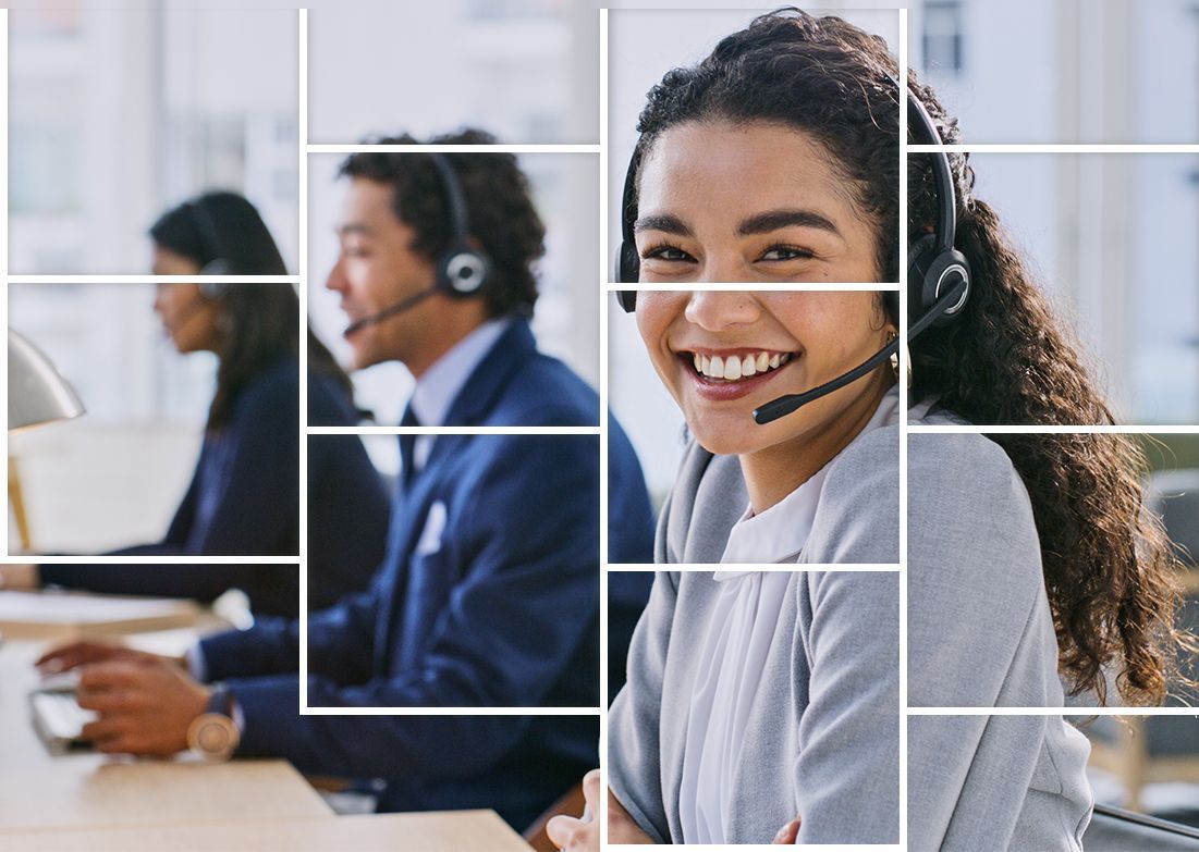 A woman wearing a headset is smiling in a call center.