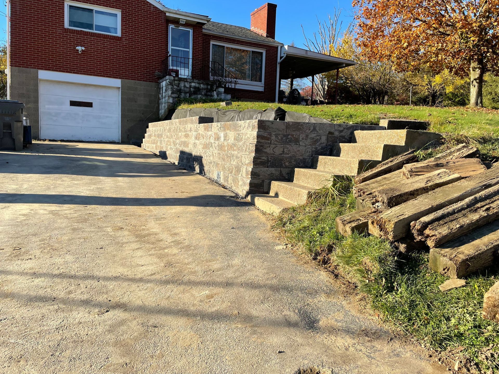 A house with a garage and stairs in front of it