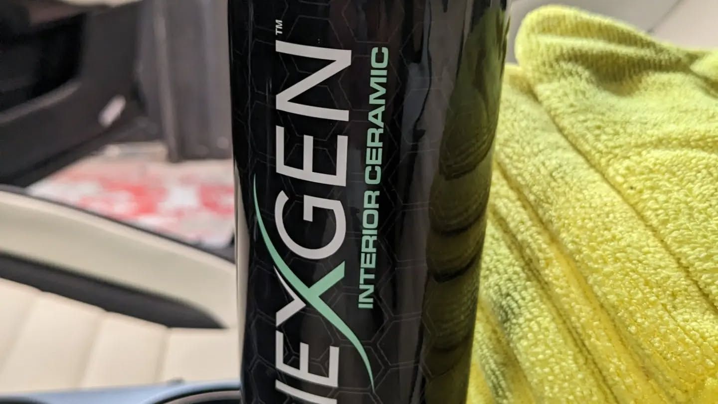 A bottle of vexgen interior ceramic sitting on top of a yellow towel.