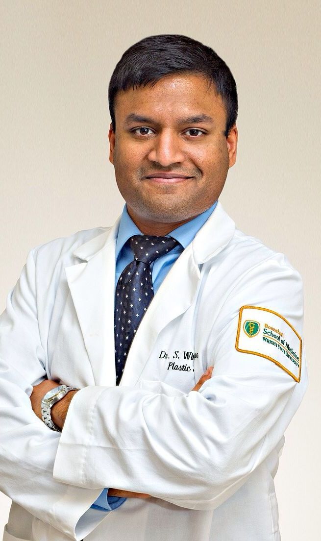 Dr. Sunishak Wimalawansa in white doctor's coat
