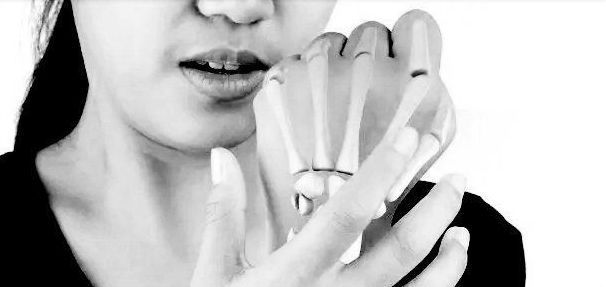closeup of woman's hand with bone illustration overlay