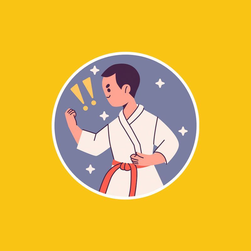 Um homem com uniforme de caratê e faixa vermelha está em pé formando um círculo.