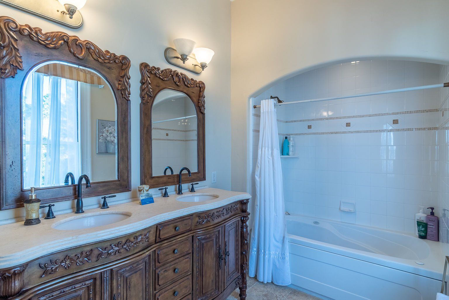 Elegant bathroom with soaking tub at Chateau Coralini, a historic Victorian inn in Salinas Valley.