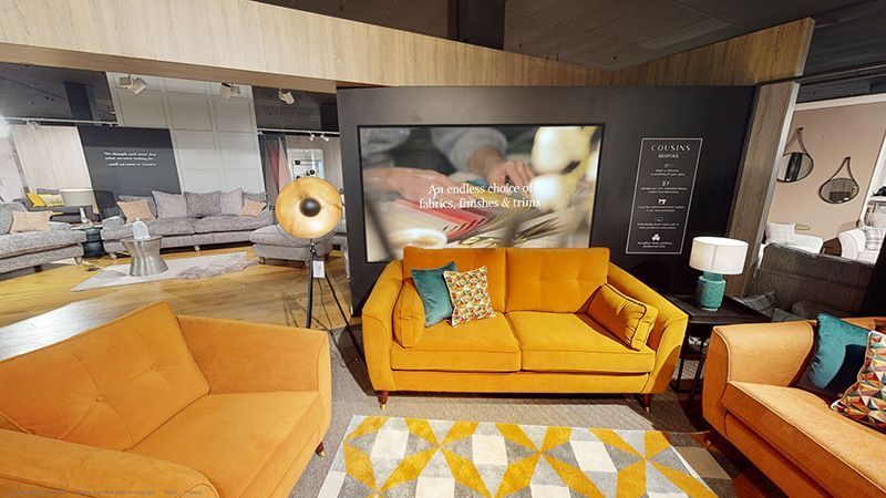 A living room filled with furniture and a yellow couch.