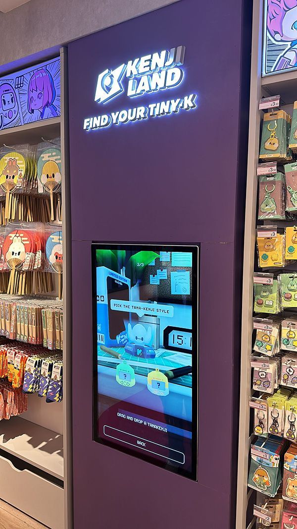 A display of a video game on a wall in a store.