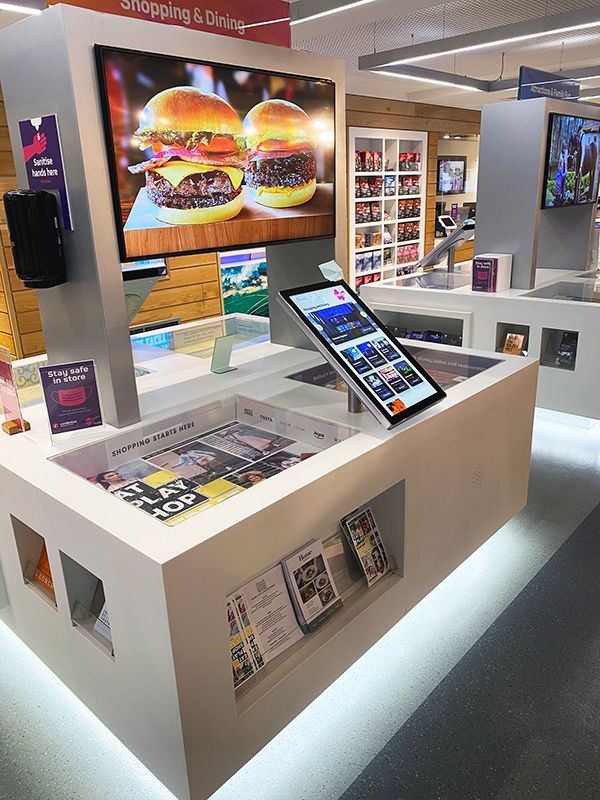 A store with a display of hamburgers on the wall
