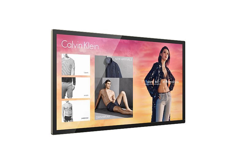A large flat screen tv with a picture of a woman on it.