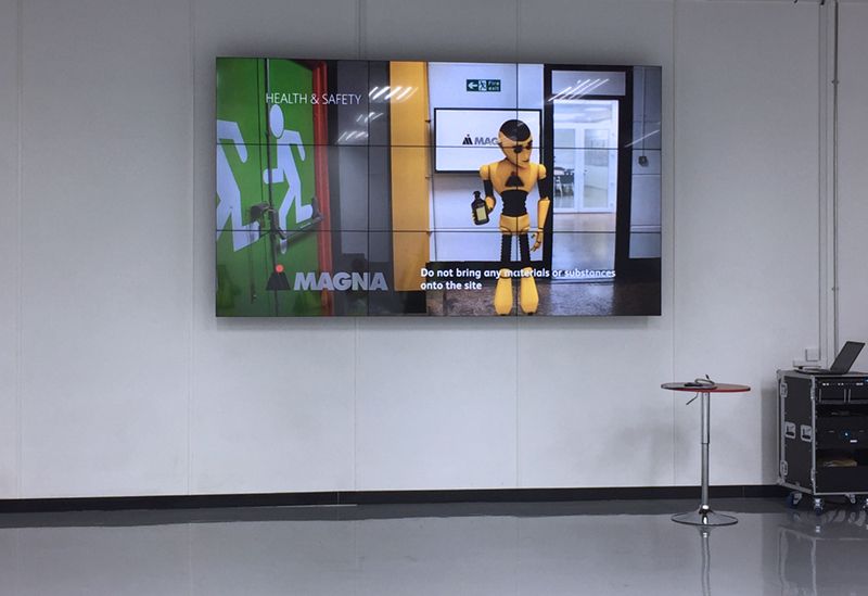A large screen with magna written on it
