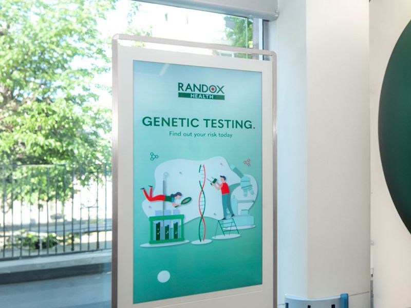 A poster for genetic testing is hanging on a wall.