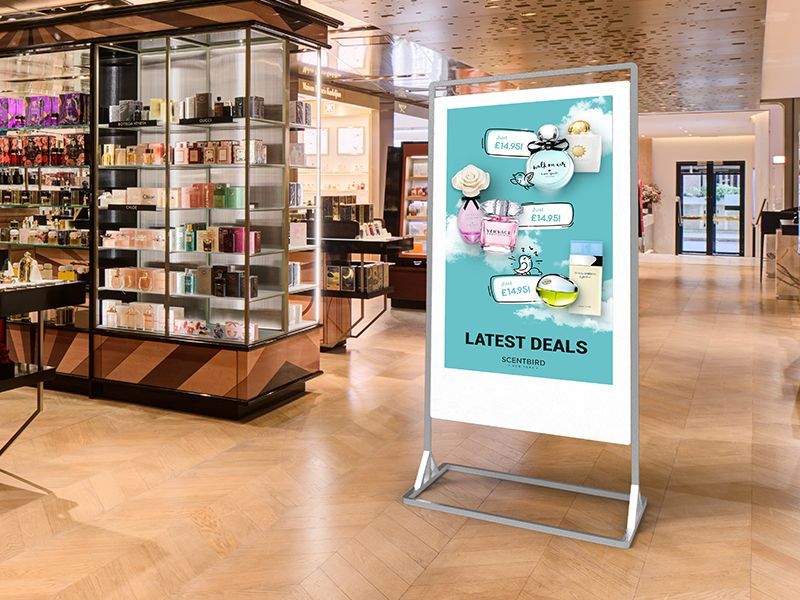 A sign in a store advertising latest deals.