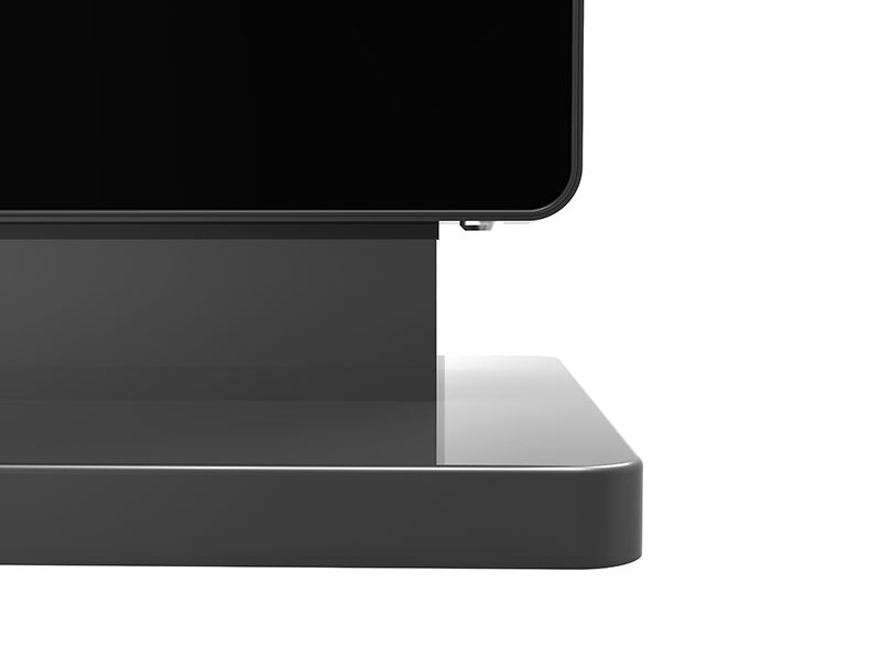 A close up of a computer monitor on a stand on a white background.
