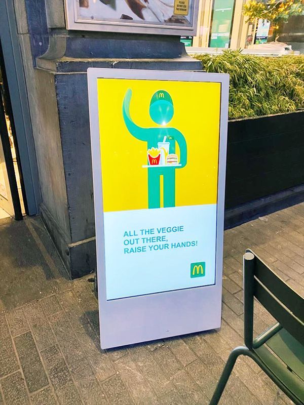 A mcdonald 's sign encourages people to wash their hands