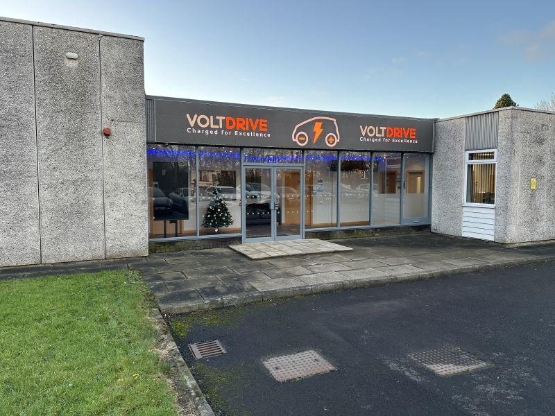 A building with a sign that says voltdrive on it